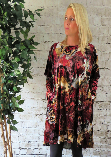 The wide tunic is made from a soft stretch red viscose velvet fabric, with a beautiful all over butterfly design. Perfect for any autumn winter occasion from a party to everyday wear. This tunic will take you from day to night with effortless style and elegance.