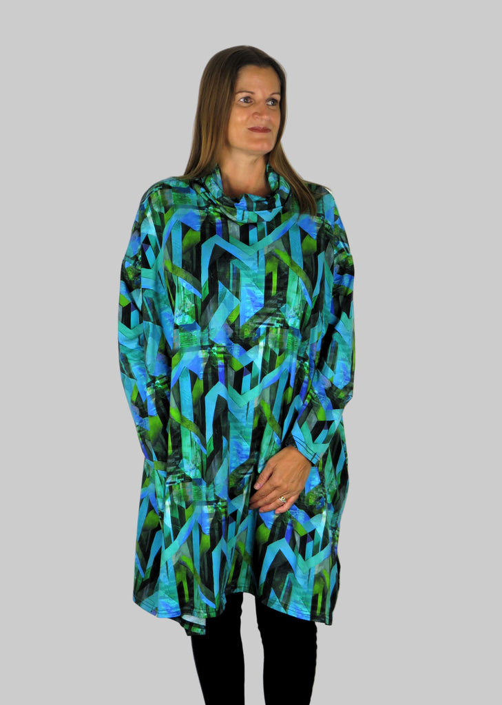 This cowl tunic is made from a soft feel blue jersey, with a beautiful all over blue and green abstract print. Perfect for any autumn winter occasion, from a wedding to any celebration to everyday wear. The tunic top will take you from day to night with effortless style and elegance.