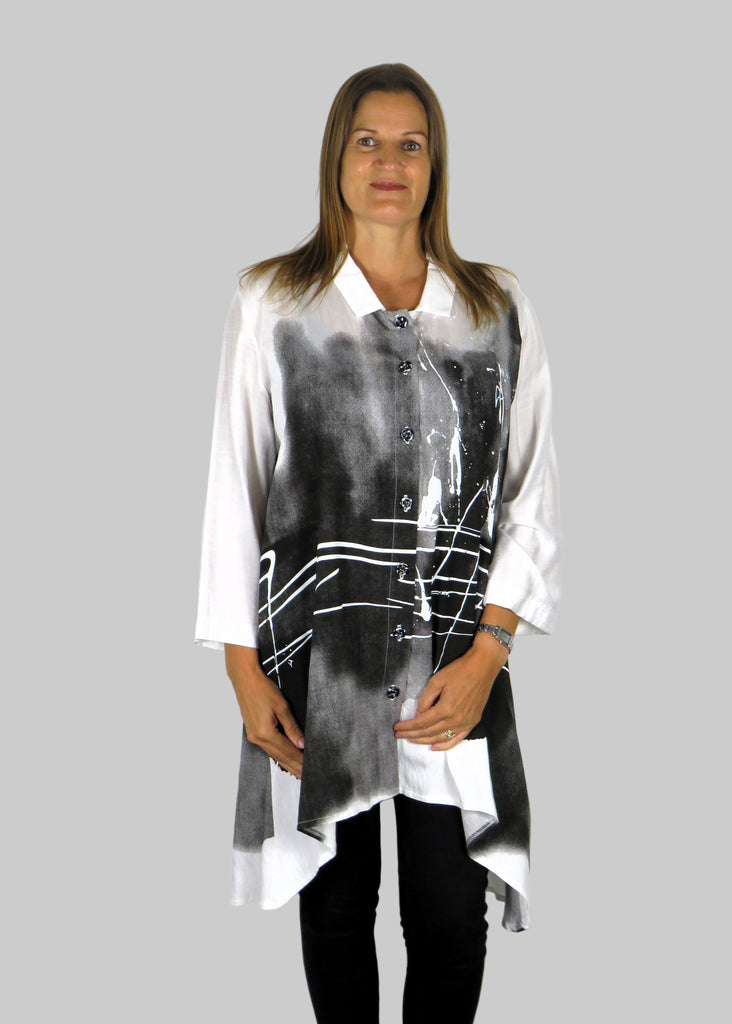 This tunic blouse is made from a white cotton fabric with a black and grey print. Perfect for any autumn winter occasion, from a party to everyday wear. This blouse will take you from day to night with effortless style and elegance.