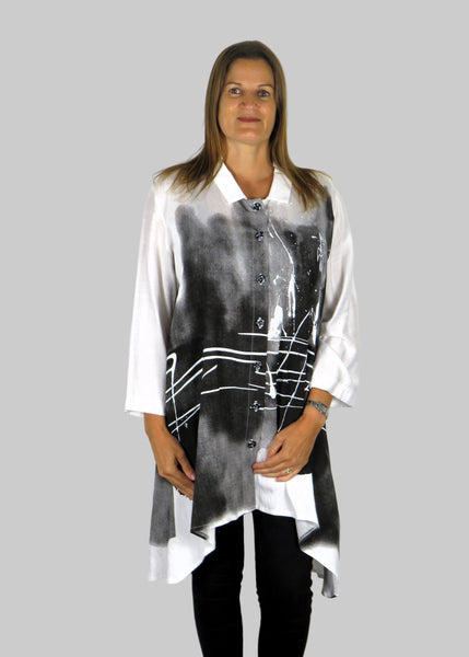 This tunic blouse is made from a white cotton fabric with a black and grey print. Perfect for any autumn winter occasion, from a party to everyday wear. This blouse will take you from day to night with effortless style and elegance.