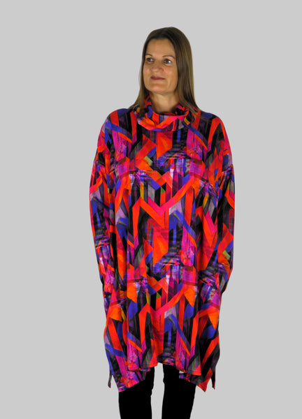 This cowl tunic is made from a soft feel red and pink jersey, with a beautiful all over abstract print. Perfect for any autumn winter occasion, from a wedding to any celebration to everyday wear. The tunic top will take you from day to night with effortless style and elegance.