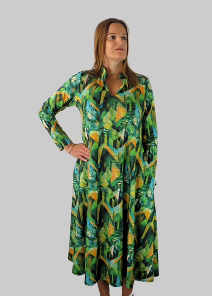 This V Collar dress is made from a soft feel jersey fabric, with an all over shades of green abstract print. Perfect for any autumn / winter occasion from a wedding, mother of the bride, mother of the groom to a party or everyday wear. This dress will take you from day to night with effortless style and elegance. Available in Abstract Aqua, Fuchsia & Green, Fusion Aqua & Gold.