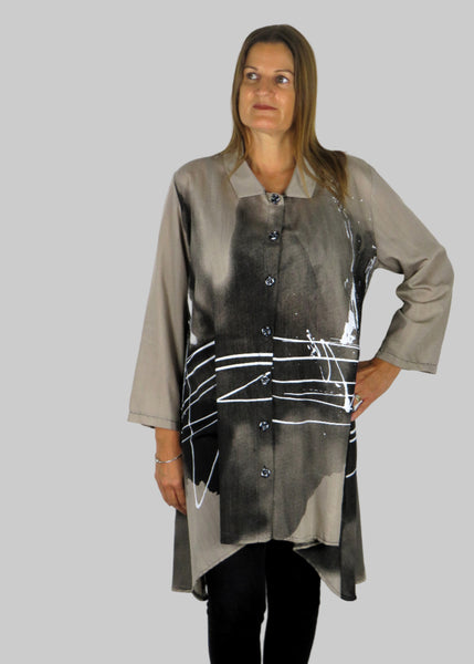 This tunic blouse is made from a stone cotton fabric with a white and grey print. Perfect for any autumn winter occasion, from a party to everyday wear. This blouse will take you from day to night with effortless style and elegance.