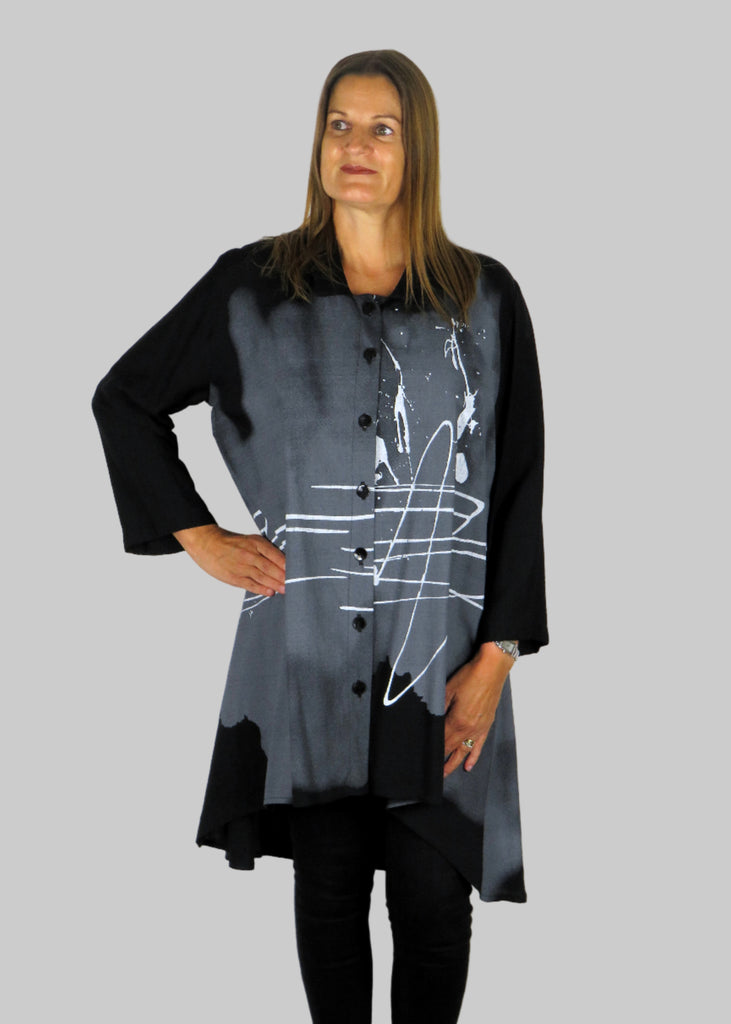 This tunic blouse is made from a black cotton fabric with a white and grey print. Perfect for any autumn winter occasion, from a party to everyday wear. This blouse will take you from day to night with effortless style and elegance