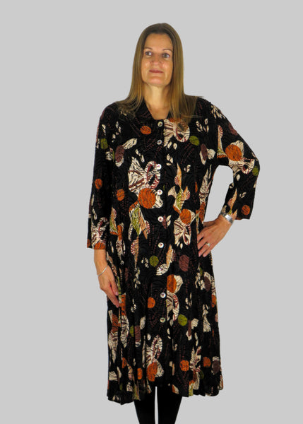 This shirt dress is made from a beautiful embossed black fabric with an autumnal design. Perfect for any autumn winter occasion, from a wedding, Mother of the Bride, Mother of the Groom, Wedding Guest to a party or everyday wear. This dress will take you from day to night with effortless style and elegance.
