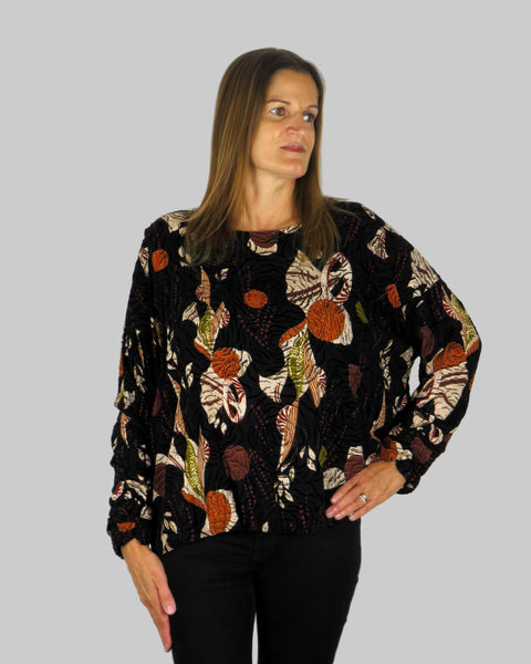 This wide top is made from a embossed black autumnal print fabric. Perfect for any autumn winter occasion, from a party to everyday wear. This top will take you from day to night with effortless style and elegance.