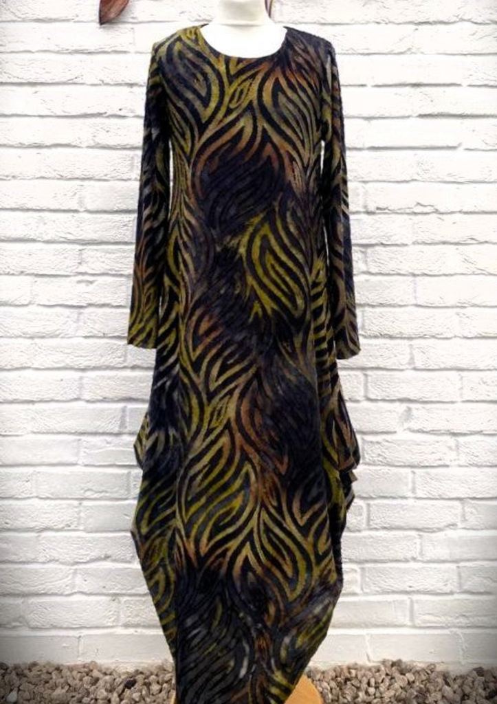 The dress is made from a soft black jersey devore fabric, with an all over design. The dress has a hitch up hem on both sides, which can be buttoned up or let down for a longer length. Perfect for any autumn winter occasion, from a wedding Mother of the Bride, Mother of the Groom, Wedding Guest to a party or everyday wear. This dress will take you from day to night with effortless style and elegance.
