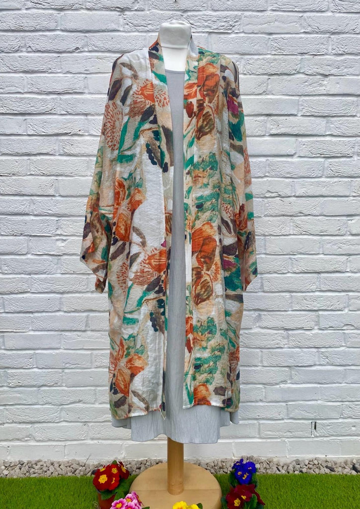 The long kimono is made from a soft printed orange chiffon with a beautiful all flower design. Perfect for any spring summer occasion, from a wedding - mother of the bride, mother of the groom and wedding guest to everyday wear. This kimono will take you from day to night with effortless style and elegance.