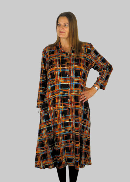 This shirt dress is made from a beautiful check fabric. Perfect for any autumn winter occasion, from a wedding, Mother of the Bride, Mother of the Groom, Wedding Guest to a party or everyday wear. This dress will take you from day to night with effortless style and elegance.