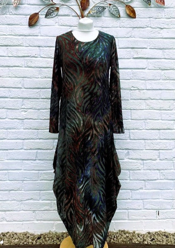 The dress is made from a soft feel black jersey devore fabric, with an all over design. The dress has a hitch up hem on both sides, which can be buttoned up or let down for a longer length. Perfect for any autumn winter occasion, from a wedding Mother of the Bride, Mother of the Groom, Wedding Guest to a party or everyday wear. This dress will take you from day to night with effortless style and elegance.