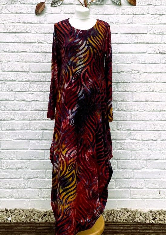 The dress is made from a soft feel jersey devore fabric, with an all over design. The dress has a hitch up hem on both sides, which can be buttoned up or let down for a longer length. Perfect for any autumn winter occasion, from a wedding Mother of the Bride, Mother of the Groom, Wedding Guest to a party or everyday wear. This dress will take you from day to night with effortless style and elegance.