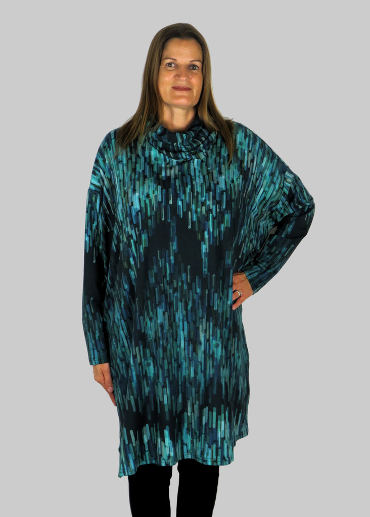This cowl tunic is made from a soft feel blue jersey, with a beautiful all over blue and grey print. Perfect for any autumn winter occasion, from a wedding to any celebration to everyday wear. The tunic top will take you from day to night with effortless style and elegance.