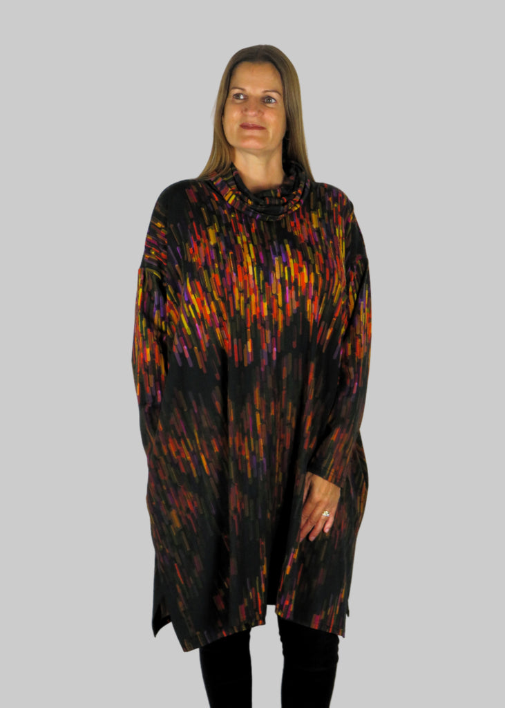 This cowl tunic is made from a soft feel black jersey, with a beautiful all over multicolour print. Perfect for any autumn winter occasion, from a wedding to any celebration to everyday wear. The tunic top will take you from day to night with effortless style and elegance.