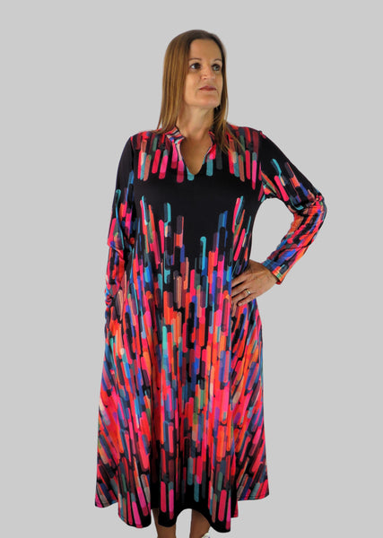 This V Collar dress is made from a soft feel black jersey fabric, with an all over multicolour print. Perfect for any autumn / winter occasion from a wedding, mother of the bride, mother of the groom to a party or everyday wear. This dress will take you from day to night with effortless style and elegance. Available in Abstract Aqua, Fuchsia & Green & Fusion Aqua & Gold.