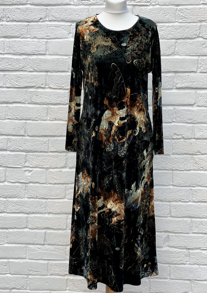 This dress is made from a soft stretch green viscose velvet fabric, with a beautiful all over butterfly design. Perfect for any autumn winter occasion, from a wedding Mother of the Bride, Mother of the Groom, Wedding Guest to a party or everyday wear. This dress will take you from day to night with effortless style and elegance.