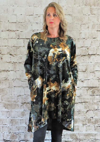 The wide tunic is made from a soft stretch green viscose velvet fabric, with a beautiful all over butterfly design. Perfect for any autumn winter occasion from a party to everyday wear. This tunic will take you from day to night with effortless style and elegance.