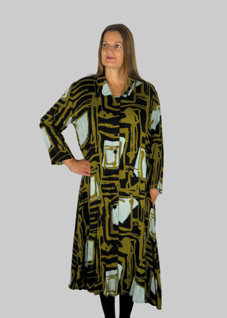 This shirt dress is made from a beautiful soft fabric with an all over gold abstract print. Perfect for any autumn winter occasion, from a wedding, Mother of the Bride, Mother of the Groom, Wedding Guest to a party or everyday wear. This dress will take you from day to night with effortless style and elegance.