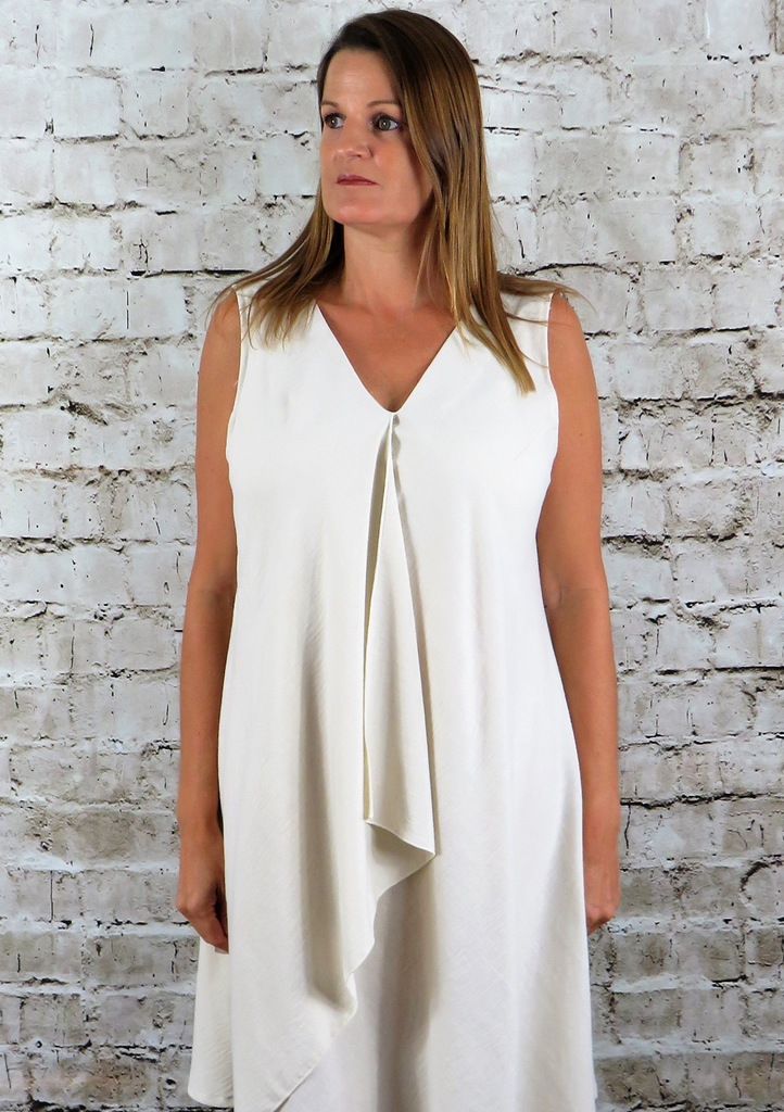 The drape dress is made from a soft viscose natural linen fabric, also available in other vibrant spring summer colours. Perfect for any occasion or everyday wear. This drape dress will take you from day to night with effortless style and elegance.