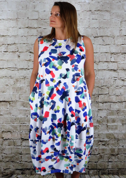 This sleeveless bell hem dress is made from a soft feel white Jersey fabric, with a beautiful all over multi colour print. Perfect for any spring summer occasion or everyday wear. This dress will take you from day to night with effortless style and elegance.
