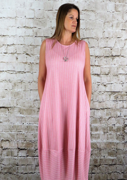 This sleeveless bell hem dress is made from a soft feel jersey fabric, with an all over lined print. Perfect for any spring summer occasion or everyday wear. This dress will take you from day to night with effortless style and elegance. Available in pink and lime.
