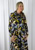 This flared dress is made from a soft feel black jersey fabric, with a beautiful all over gold and white print. Perfect for any autumn winter occasion or everyday wear. This dress will take you from day to night with effortless style and elegance.