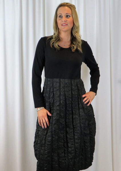 This dress is made from a soft quilted fabric with a black Jersey top. Perfect for any autumn winter occasion, from a wedding Mother of the Bride, Mother of the Groom, Wedding Guest to a party or everyday wear. This dress will take you from day to night with effortless style and elegance. Available in Brown, Green, Grey and Port.