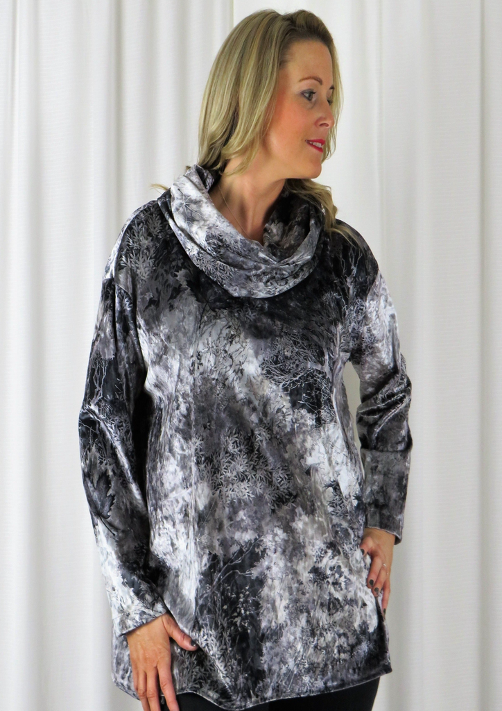 This wide top is made from a soft stretch viscose velvet fabric, with a beautiful all over silver autumnal design with a cowl neck. Perfect for any autumn winter occasion, from a party to everyday wear. This top will take you from day to night with effortless style and elegance.