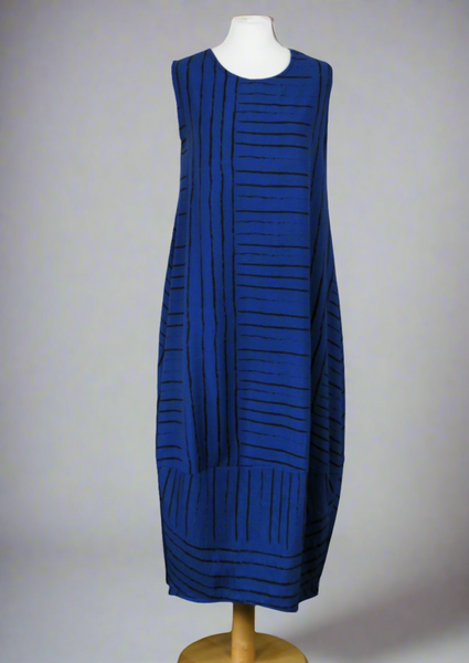 This dress is made from a soft navy linen with a beautiful all over print. Perfect for any spring summer occasion, from a wedding to a party and everyday wear. This dress will take you from day to night with effortless style and elegance.