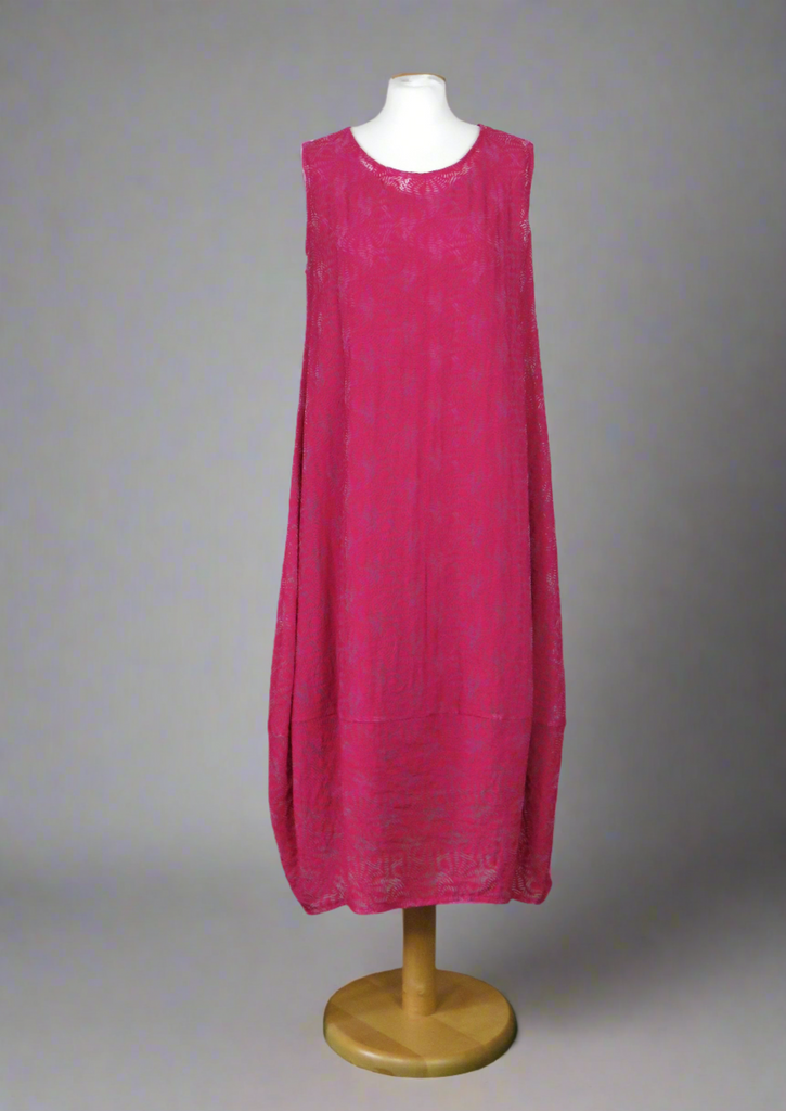 This sleeveless dress is made from a cerise sheer fabric with a beautiful all over shell design, and a soft viscose lining. Perfect for any spring summer occasion, from a wedding - mother of the bride, mother of the groom and wedding guest to everyday wear. This dress will take you from day to night with effortless style and elegance. A matching shrug is available.