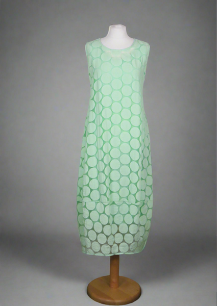 This sleeveless dress is made from a green sheer fabric with a beautiful all over spot design, and a soft viscose lining. Perfect for any spring summer occasion, from a wedding - mother of the bride, mother of the groom and wedding guest to everyday wear. This dress will take you from day to night with effortless style and elegance. A matching shrug is available.
