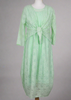 This sleeveless dress is made from a green sheer fabric with a beautiful all over shell design, and a soft viscose lining. Perfect for any spring summer occasion, from a wedding - mother of the bride, mother of the groom and wedding guest to everyday wear. This dress will take you from day to night with effortless style and elegance. A matching shrug is available.