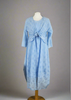 This sleeveless dress is made from a blue sheer fabric with a beautiful all over shell design, and a soft viscose lining. Perfect for any spring summer occasion, from a wedding - mother of the bride, mother of the groom and wedding guest to everyday wear. This dress will take you from day to night with effortless style and elegance. A matching shrug is available.