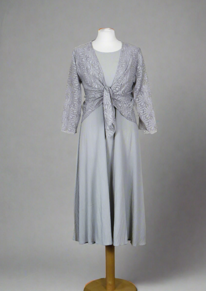 The shrug is made from a soft sheer silver fabric with a beautiful shell design. Perfect for any spring summer occasion, from a wedding - mother of the bride, mother of the groom and wedding guest to everyday wear. This shrug will take you from day to night with effortless style and elegance. Matching dresses available.