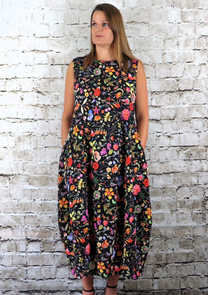 This sleeveless dress is made from a soft feel cotton fabric, with a beautiful all over flower print. Perfect for any occasion, from a wedding to everyday wear. This dress will take you from day to night with effortless style and elegance.