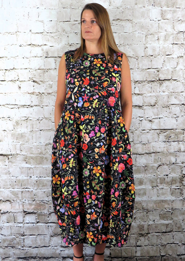 This sleeveless dress is made from a soft feel cotton fabric, with a beautiful all over flower print. Perfect for any spring summer occasion, from a wedding to a party and everyday wear. This dress will take you from day to night with effortless style and elegance.