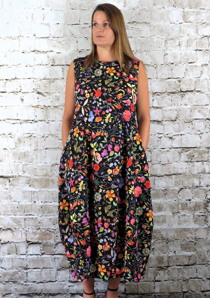 This sleeveless dress is made from a soft feel cotton fabric, with a beautiful all over flower print. Perfect for any spring summer occasion, from a wedding to a party and everyday wear. This dress will take you from day to night with effortless style and elegance.