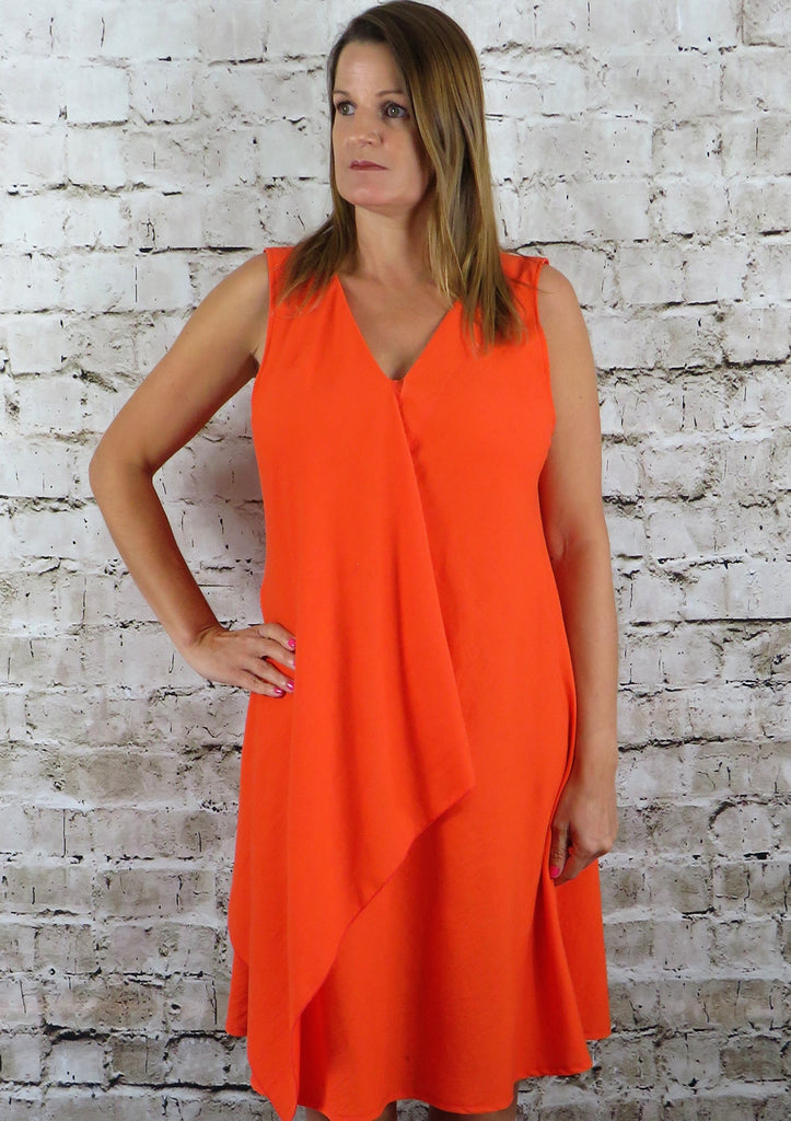 The sleeveless drape dress is made from a soft viscose orange linen fabric, also available in other vibrant spring summer colours. Perfect for any occasion or everyday wear This drape dress will take you from day to night with effortless style and elegance.