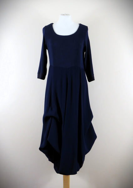 The Fine Rib Multi Hitch Panel Dress is made from a luxurious soft stretch blueberry fabric. The dress has 8 different hitch points or can be worn completely down for a full length look. Perfect for any autumn winter occasion, from a wedding Mother of the Bride, Mother of the Groom, Wedding Guest to a party or everyday wear. This dress will take you from day to night with effortless style and elegance.