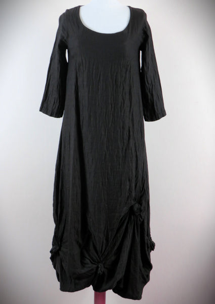 This knot dress is made from a black Linen Viscose fabric. Perfect for any autumn winter occasion, from a wedding Mother of the Bride, Mother of the Groom, Wedding Guest to a party or everyday wear. This dress will take you from day to night with effortless style and elegance.