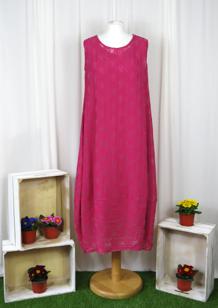 This sleeveless dress is made from a cerise sheer fabric with a beautiful all over shell design, and a soft viscose lining. Perfect for any spring summer occasion, from a wedding - mother of the bride, mother of the groom and wedding guest to everyday wear. This dress will take you from day to night with effortless style and elegance. A matching shrug is available.