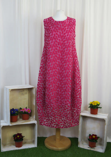 This sleeveless dress is made from a beautiful cerise leaf embroidery with a viscose lining. Perfect for any spring summer occasion, from a wedding - mother of the bride, mother of the groom and wedding guest to everyday wear. This dress will take you from day to night with effortless style and elegance.