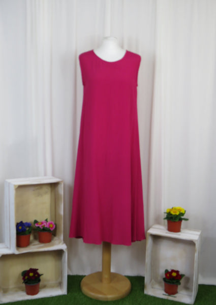 This sleeveless dress is made from a soft cerise crepe fabric. Perfect for any spring summer occasion, from a wedding - mother of the bride, mother of the groom and wedding guest to everyday wear. This dress will take you from day to night with effortless style and elegance. A matching shrug is available.