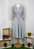 The shrug is made from a soft sheer silver fabric with a beautiful spot design. Perfect for any spring summer occasion, from a wedding - mother of the bride, mother of the groom and wedding guest to everyday wear. This shrug will take you from day to night with effortless style and elegance. Matching dresses available.