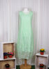 This sleeveless dress is made from a green sheer fabric with a beautiful all over stripe design, and a soft viscose lining. Perfect for any spring summer occasion, from a wedding - mother of the bride, mother of the groom and wedding guest to everyday wear. This dress will take you from day to night with effortless style and elegance. A matching shrug is available.