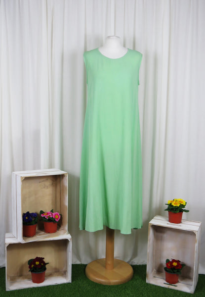 This sleeveless dress is made from a soft green crepe fabric. Perfect for any spring summer occasion, from a wedding - mother of the bride, mother of the groom and wedding guest to everyday wear. This dress will take you from day to night with effortless style and elegance. A matching shrug is available. 