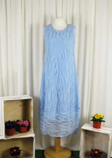 This sleeveless dress is made from a blue sheer fabric with a beautiful all over stripe design, and a soft viscose lining. Perfect for any spring summer occasion, from a wedding - mother of the bride, mother of the groom and wedding guest to everyday wear. This dress will take you from day to night with effortless style and elegance. A matching shrug is available.