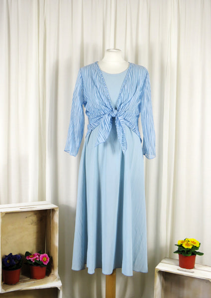 The shrug is made from a soft sheer blue fabric with a beautiful stripe design. Perfect for any spring summer occasion, from a wedding - mother of the bride, mother of the groom and wedding guest to everyday wear. This shrug will take you from day to night with effortless style and elegance. Matching dresses available.