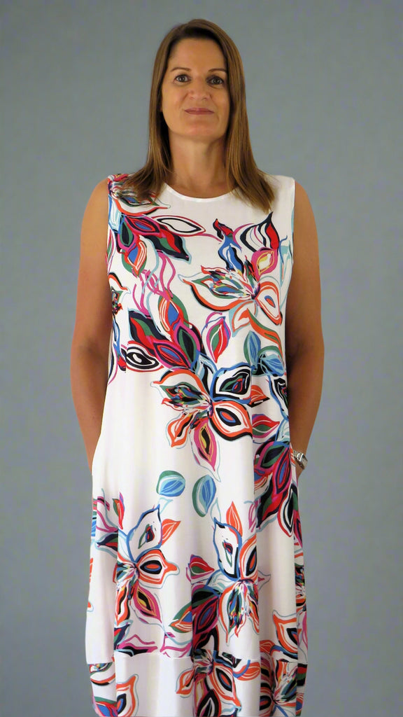 This white sleeveless dress is made from a soft feel Jersey fabric, with a beautiful all over multi colour print. Perfect for any spring summer occasion, from a wedding to everyday wear. This dress will take you from day to night with effortless style and elegance.