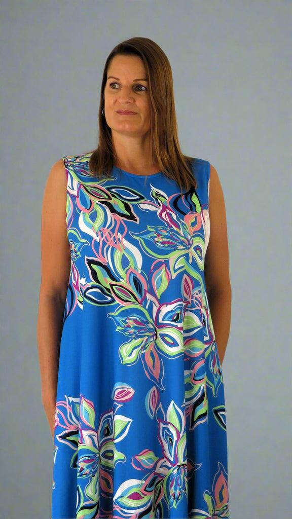 This blue sleeveless dress is made from a soft feel Jersey fabric, with a beautiful all over multi colour print. Perfect for any spring summer occasion, from a wedding to everyday wear. This dress will take you from day to night with effortless style and elegance