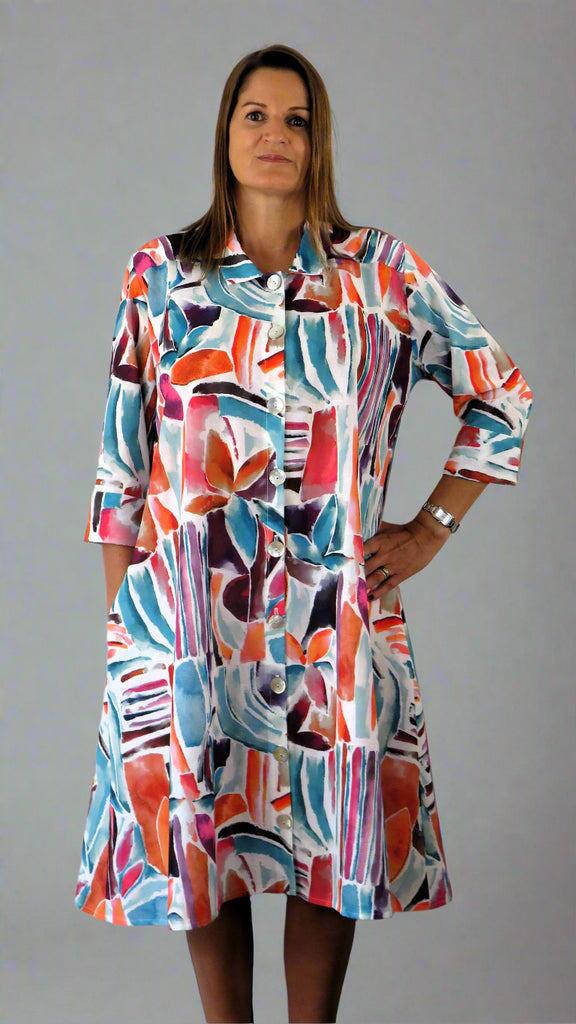 This coat dress is made from a soft white linen, with a beautiful all over colourful print. Perfect for any spring summer occasion, from a wedding - mother of the bride, mother of the groom and wedding guest to everyday wear. This coat dress will take you from day to night with effortless style and elegance.